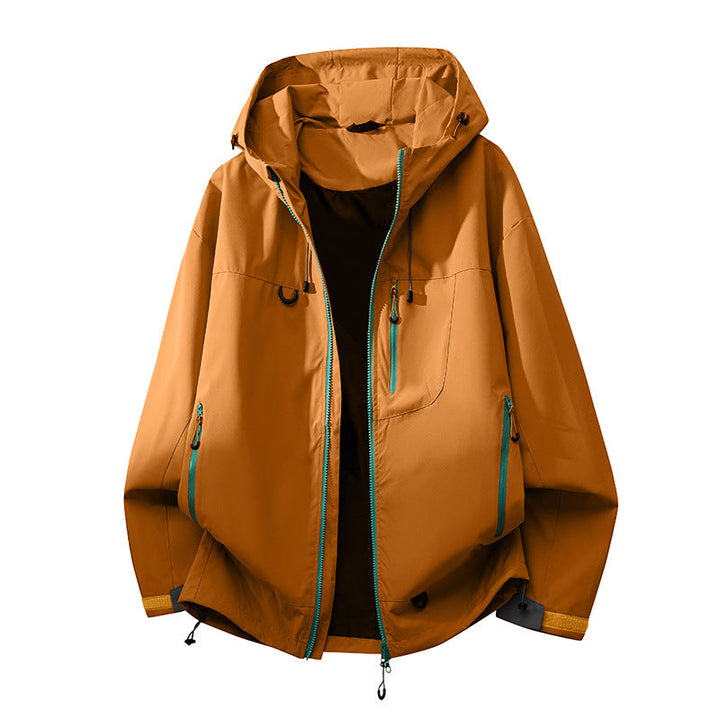 Full shot of woman wearing a women's waterproof technical outdoor jacket, ready for outdoor adventures.