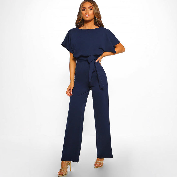 Close-up of the elegant tied waist detail on a women's wide-leg jumpsuit, showcasing its chic design.