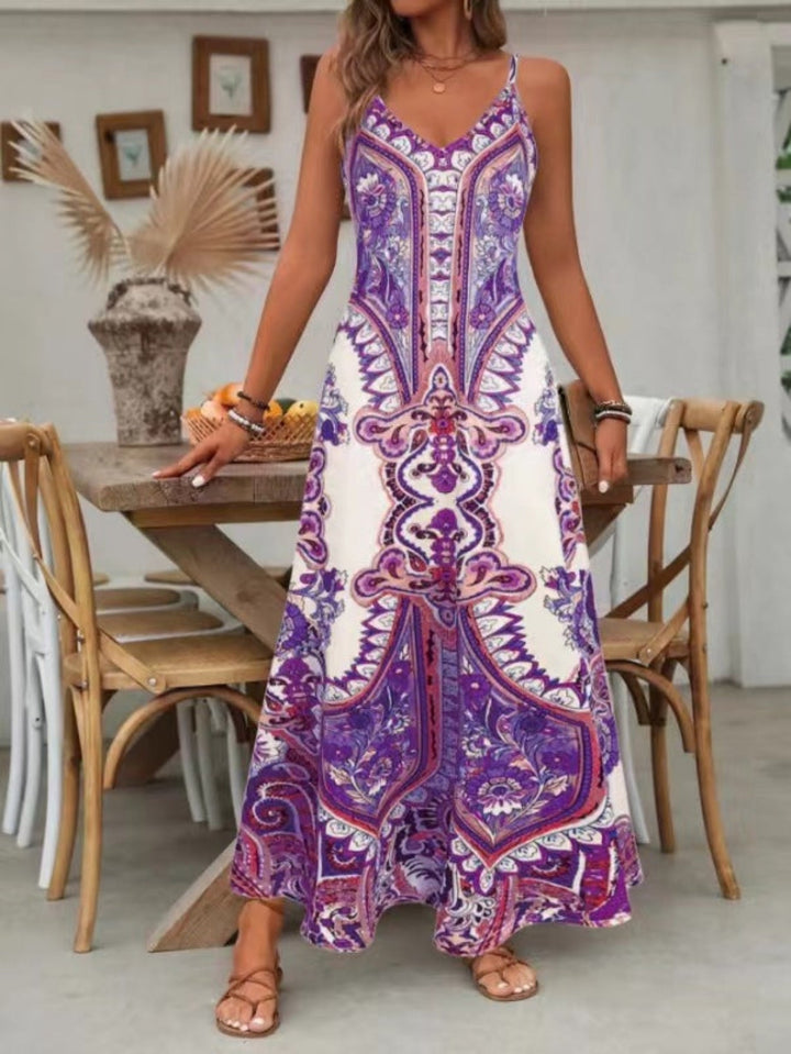 Bohemian style long summer dress with paisley print, elegant V-neck, and flowy silhouette, ideal for daywear.