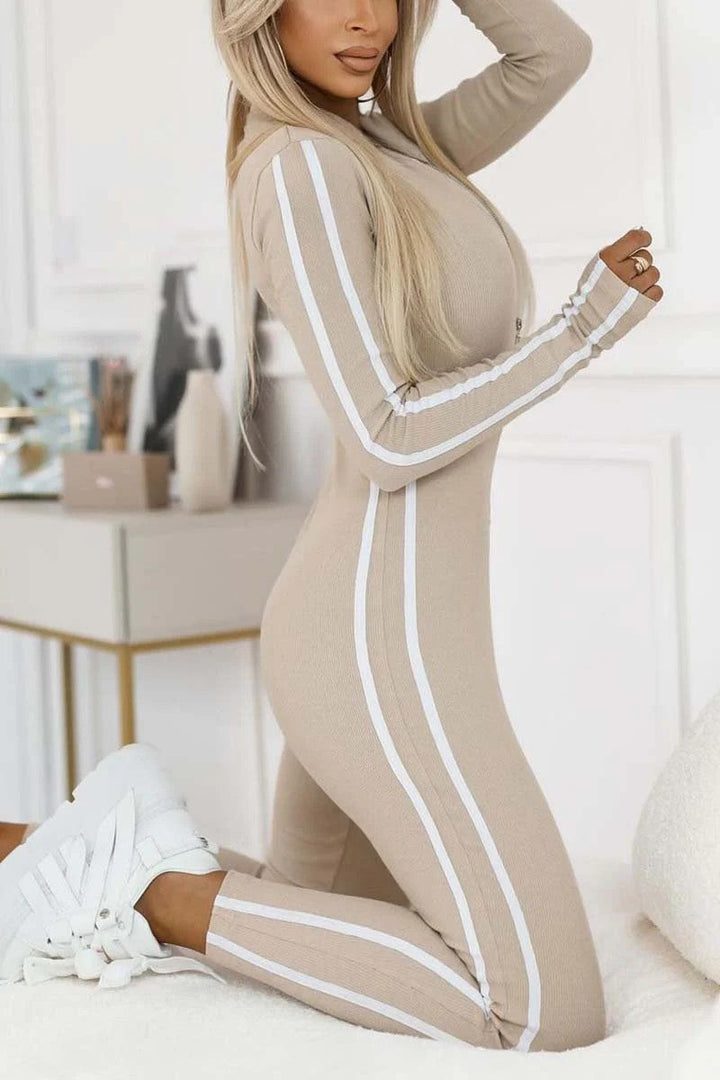 Fashion-forward women's striped long sleeve bodysuit, a sleek and sporty activewear option.