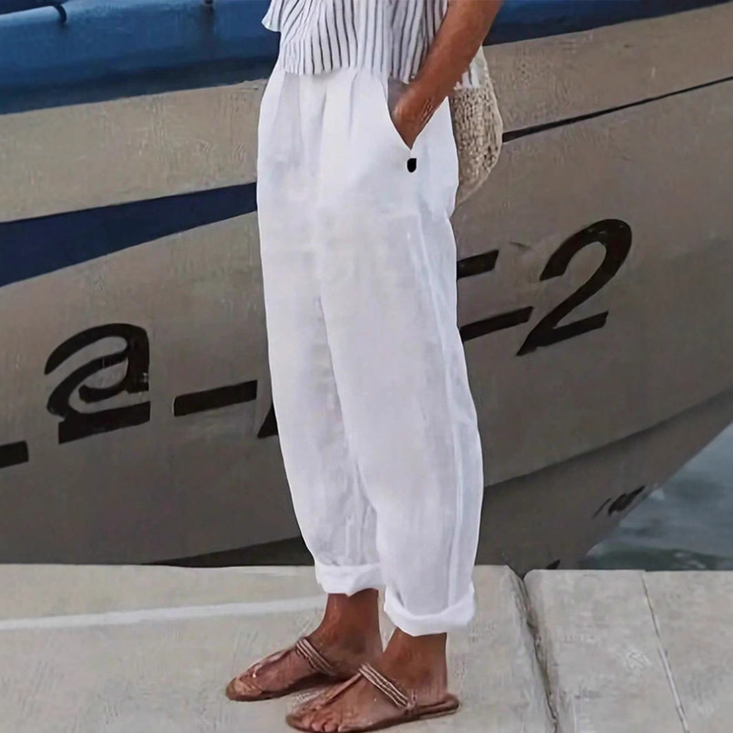 White lightweight women's summer pants with elastic waist and pockets. Perfect for casual comfort.