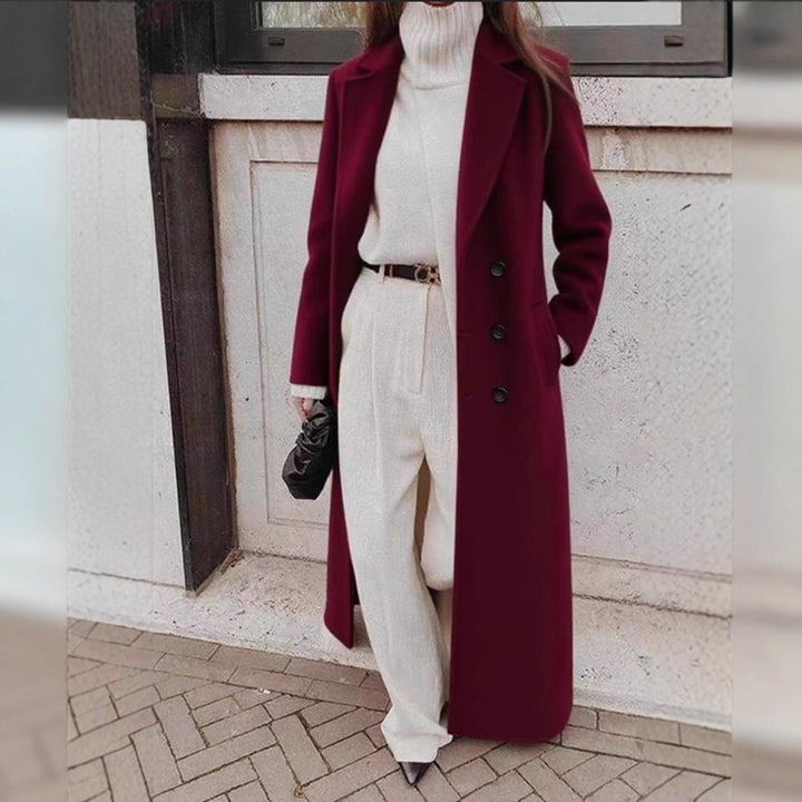 Sophisticated women's winter coat featuring a double-breasted design and practical deep pockets.