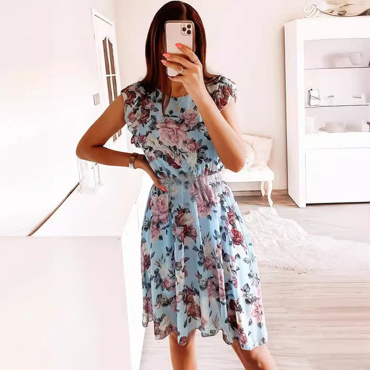 Women's floral print midi dress with charming ruffle sleeves & a comfortable relaxed fit. Elegant summer fashion.