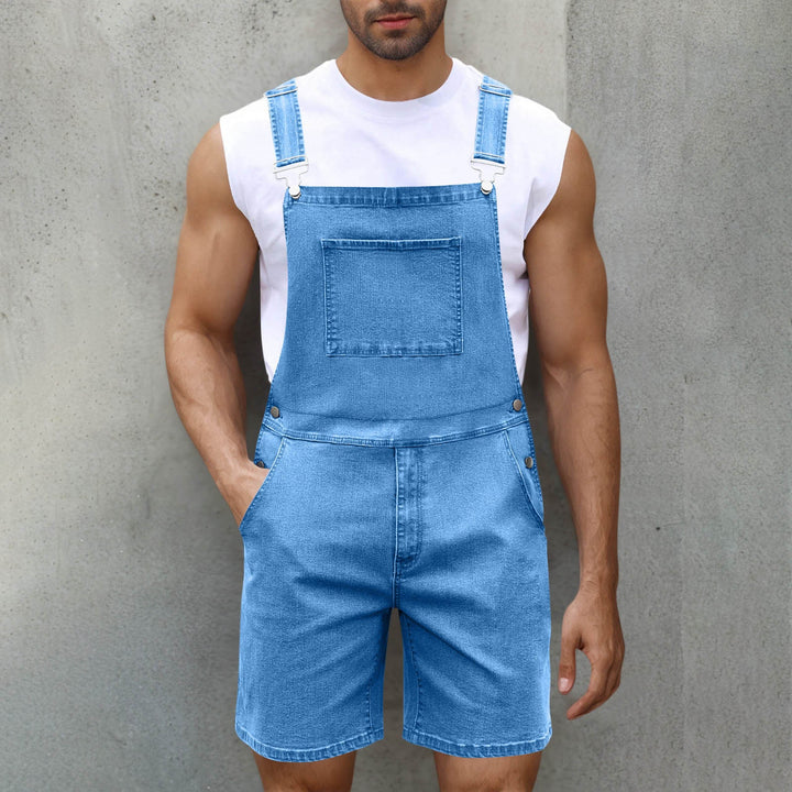 Man wearing fashionable men's overalls. Casual jumpsuit with adjustable straps, suitable for daily wear.