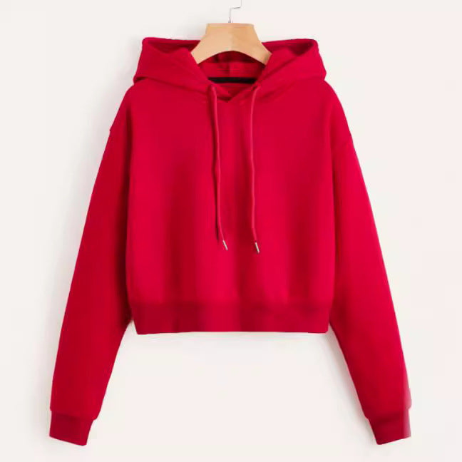 Woman enjoying leisurewear in a comfortable, fashionable cropped hoodie.