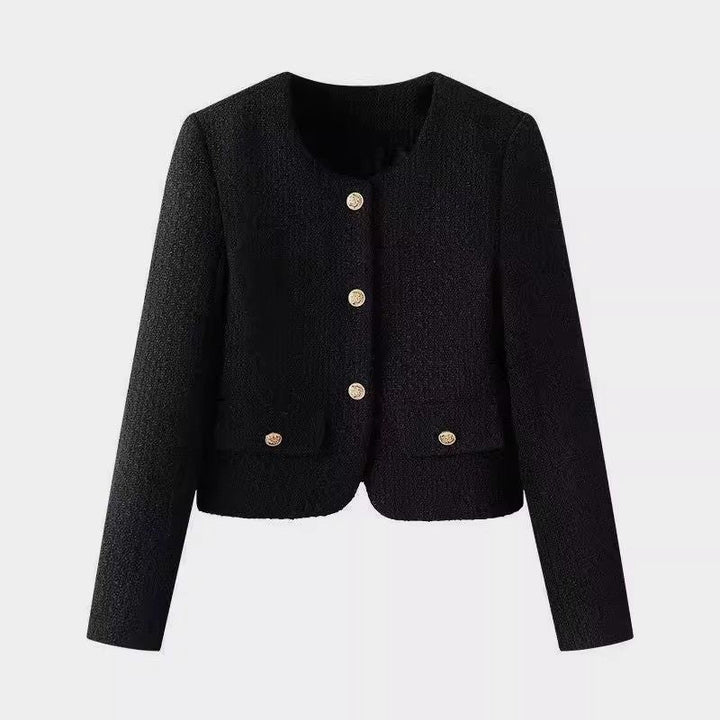 Women's elegant short jacket with prominent gold buttons, perfect for chic office or evening wear.