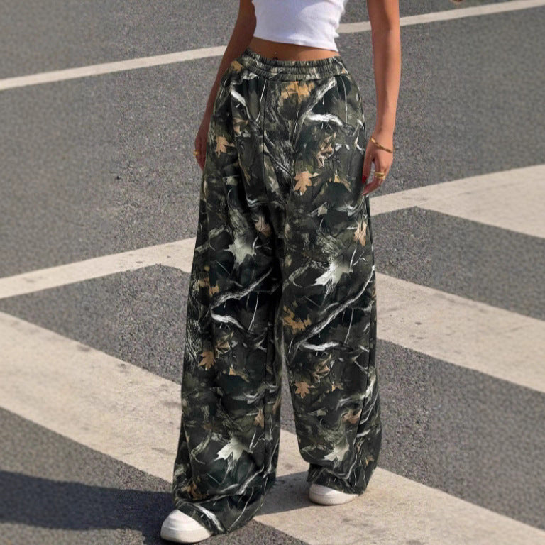 Stylish women's wide leg pants featuring a unique print and elastic waist, perfect for versatile fashion.