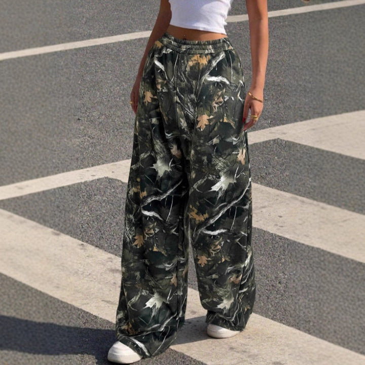 Stylish women's wide leg pants featuring a unique print and elastic waist, perfect for versatile fashion.