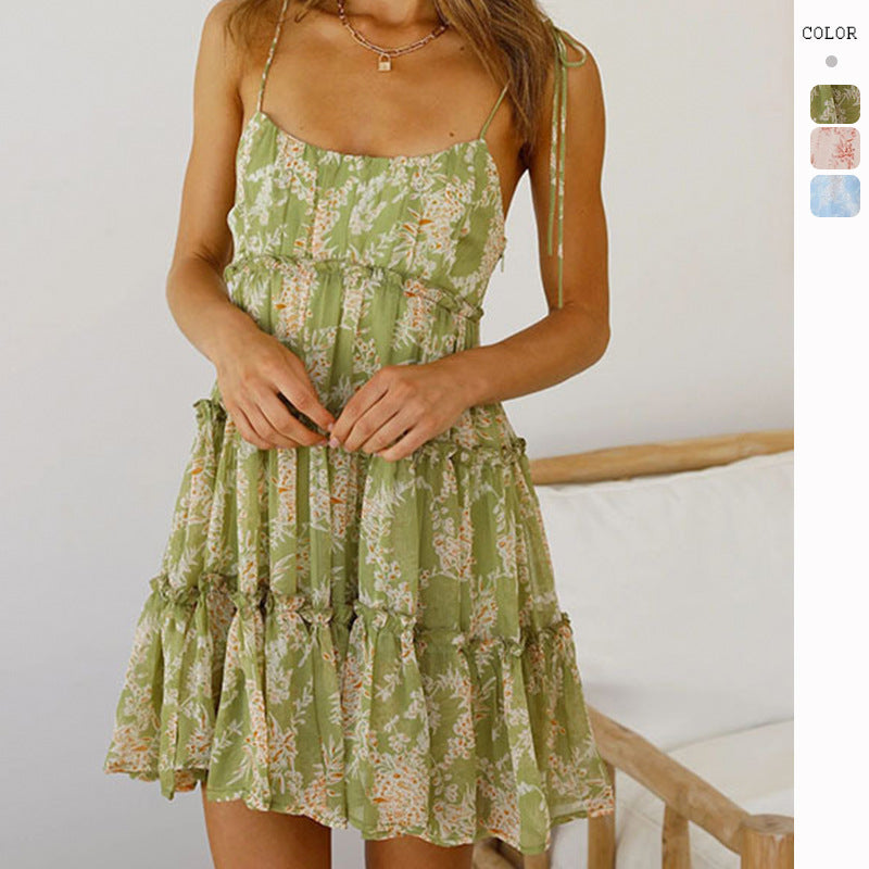 Women's floral ruffle mini dress with adjustable straps, perfect for summer casual wear or a stylish beach look.