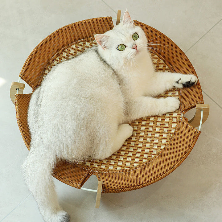Natural rattan cooling mat for cats. Breathable woven design offers a comfortable, elevated summer cat bed.