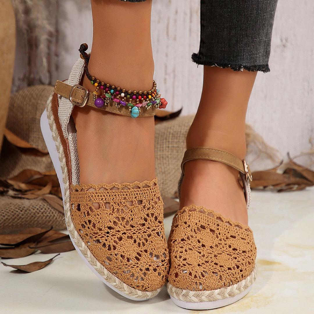 Elegant women's flat espadrilles in beige with a chic ankle strap, perfect for summer comfort & style.