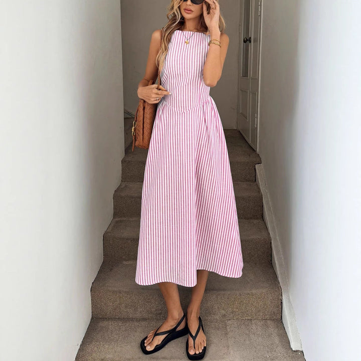 Summer fashion: women's striped midi dress with a fitted, elegant silhouette and round neck.