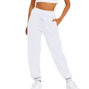 Chic women's joggers offering stylish comfort; elastic waist, practical pockets for active or lounge wear.