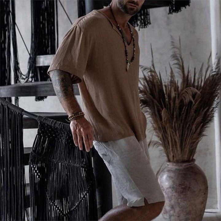 Comfortable men's V-neck top, short sleeve, designed with a relaxed fit for breathable warm weather style.