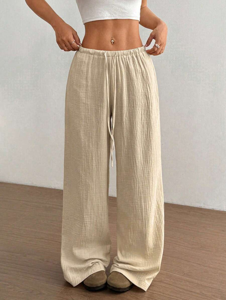 Relaxed fit women's wide leg flowy trousers. Comfortable and chic for casual summer fashion and versatile everyday style.