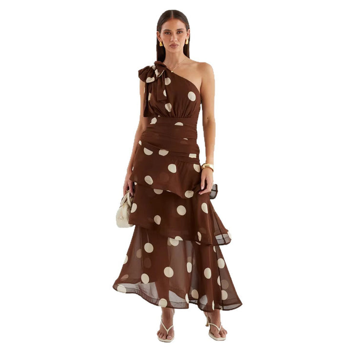 Stunning asymmetrical women's maxi dress featuring a chic one-shoulder top and voluminous polka dot skirt.