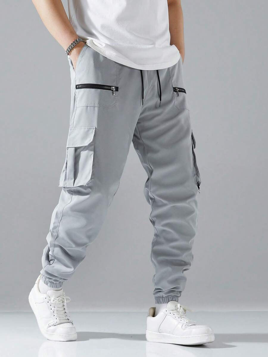 Modern men's urban cargo pants, combining street style with practical utility pockets & comfortable fit.