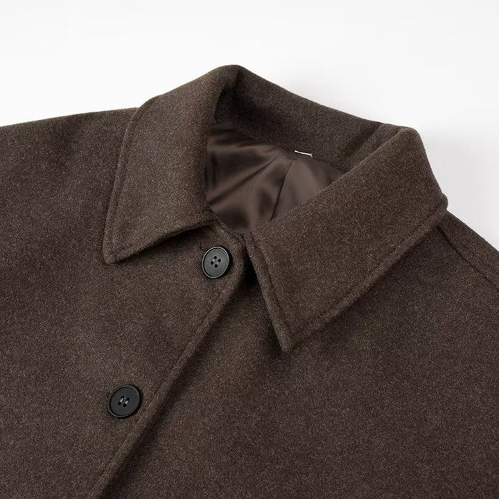 Stylish cropped jacket for women, featuring elegant design, long sleeves, and decorative buttons. Fashion outerwear.