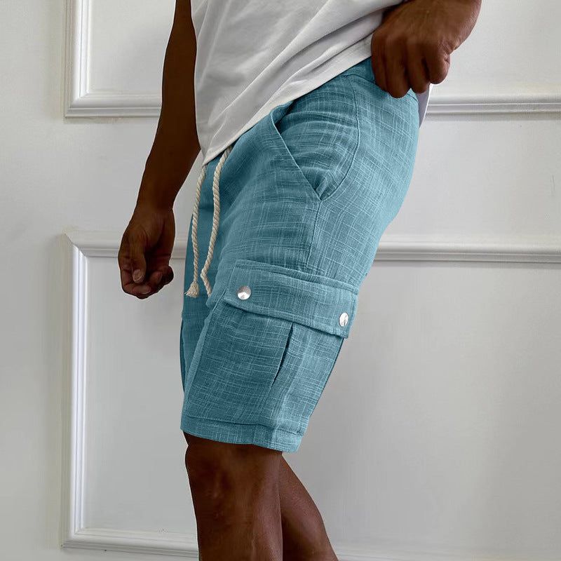 Close-up of men's cargo shorts showing practical side and thigh utility pockets, ideal for outdoor activities.