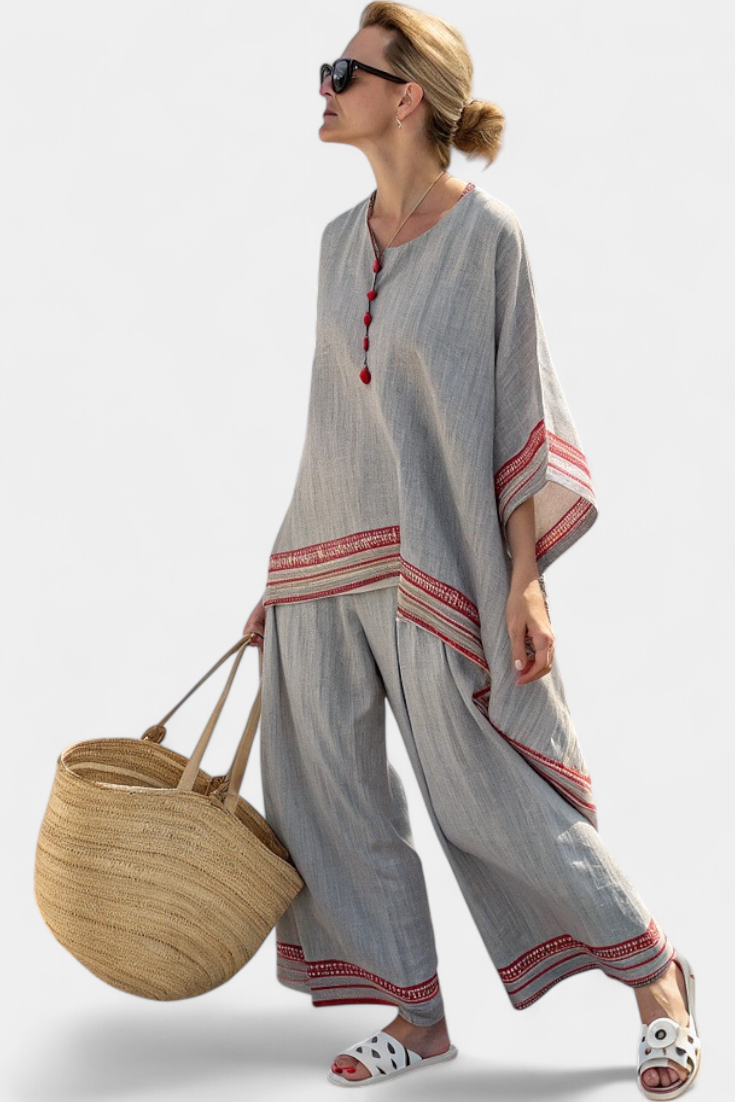 Comfortable women's ethnic two-piece set, featuring a red stripe asymmetrical top & wide-leg pants for vacation wear.