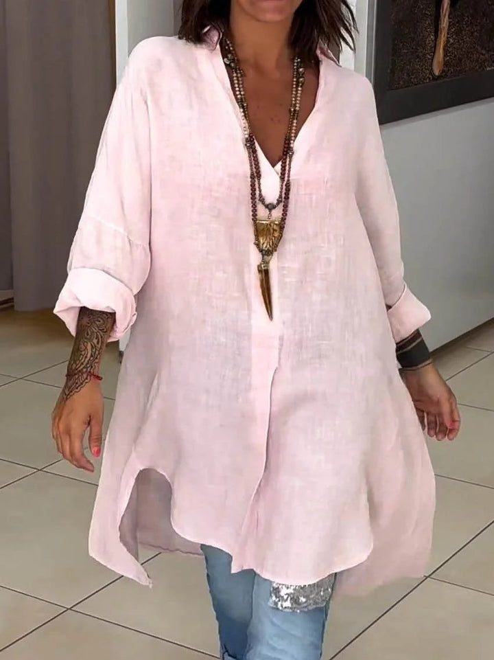 Relaxed fit women's collared shirt, versatile button-down top with roll-up sleeves for everyday wear.