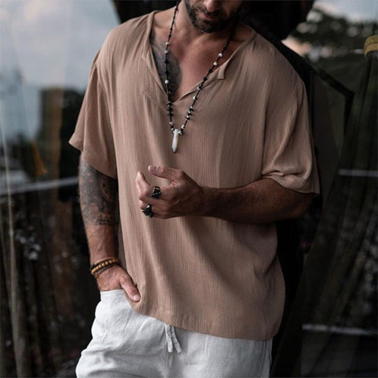 Stylish men's V-neck top for warm days, featuring a breathable fabric and comfortable relaxed fit.