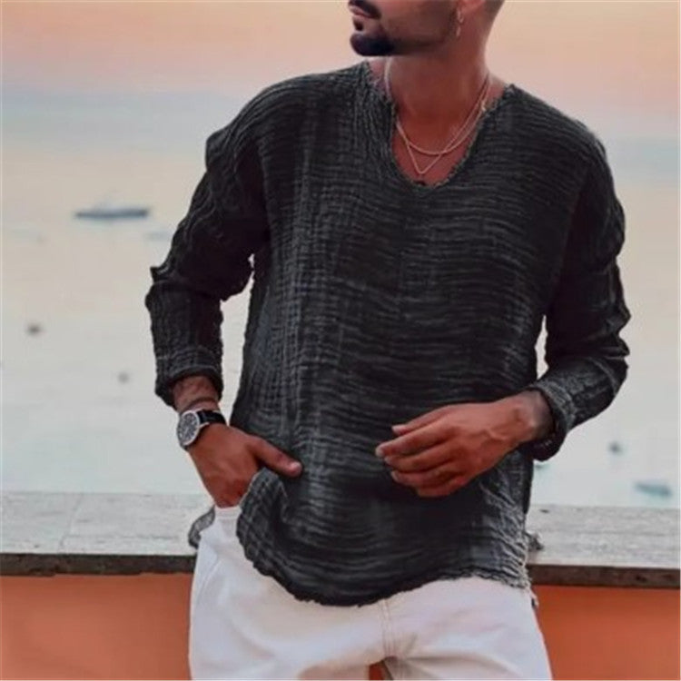 Close-up of men's V-neck shirt fabric, highlighting casual texture & quality for summer comfort.