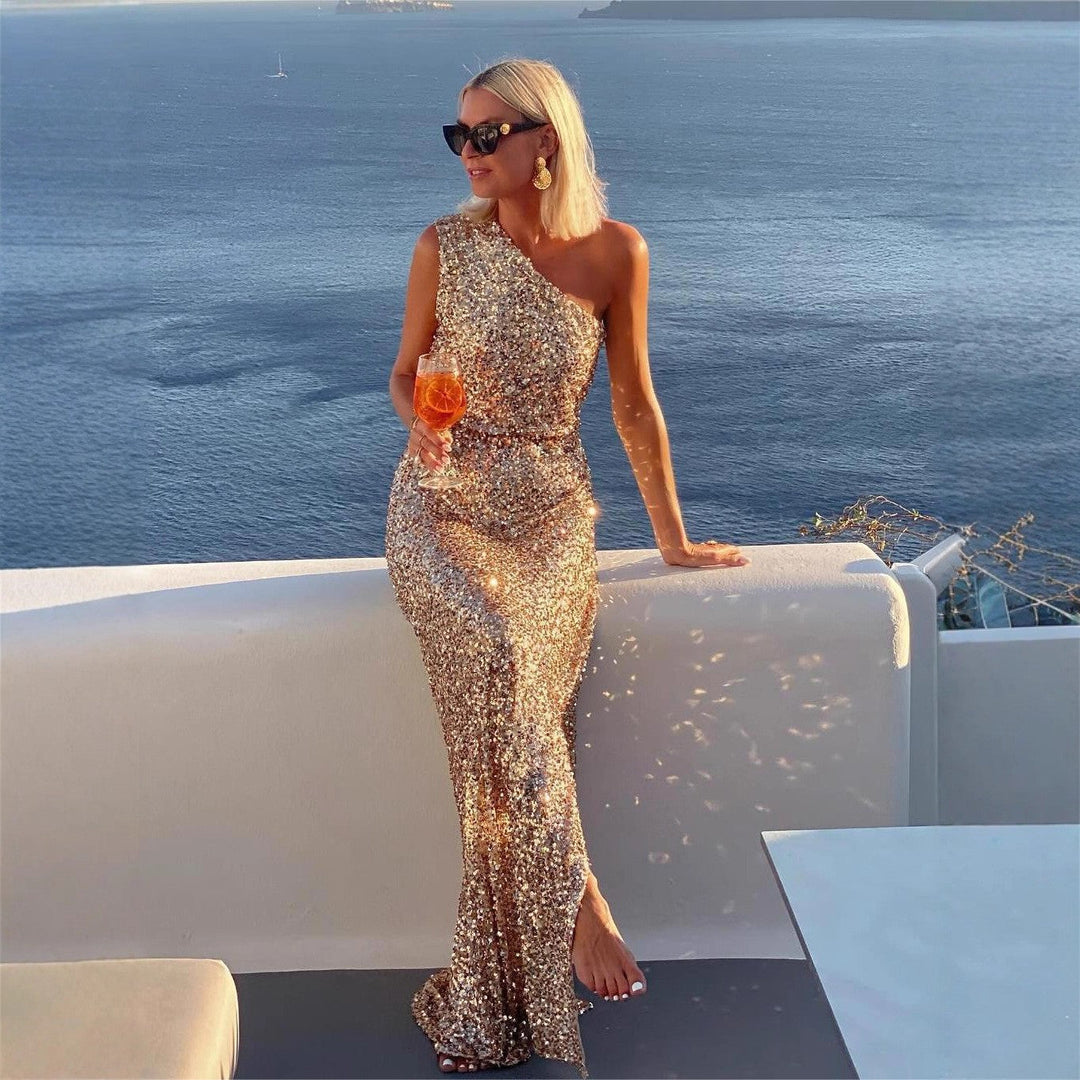 Sparkling women's cocktail dress, long & elegant, with shimmering sequins and a stylish side slit detail.