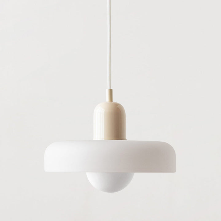 Bauhaus style pendant light with unique colored glass design for interiors.