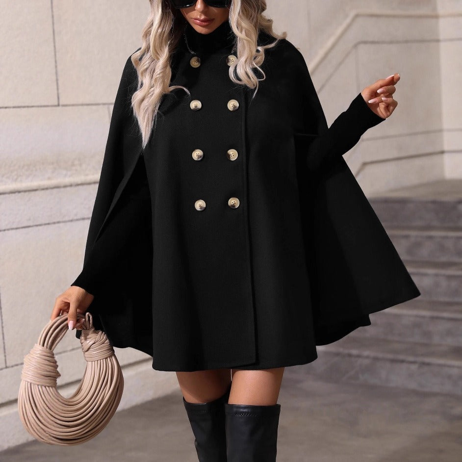 Chic women's double-breasted cape jacket, perfect for elegant fall and winter style. Versatile outerwear.