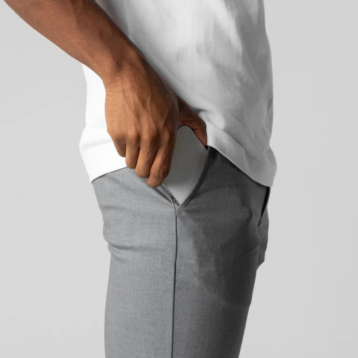 Modern men's slim fit chino trousers, elastic waist for smart casual versatility & comfort in fashion.