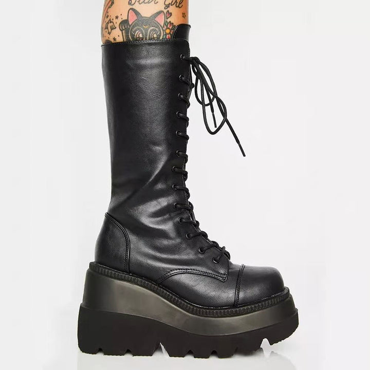 Versatile women's black ankle boots: lace-up front, sturdy platform heel, and practical side zipper for easy wear.