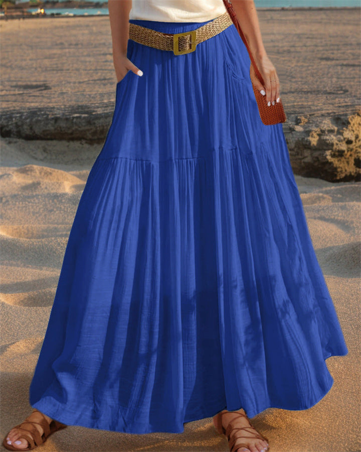 Sophisticated women's long skirt, pleated and flowy, with pockets for everyday elegance.