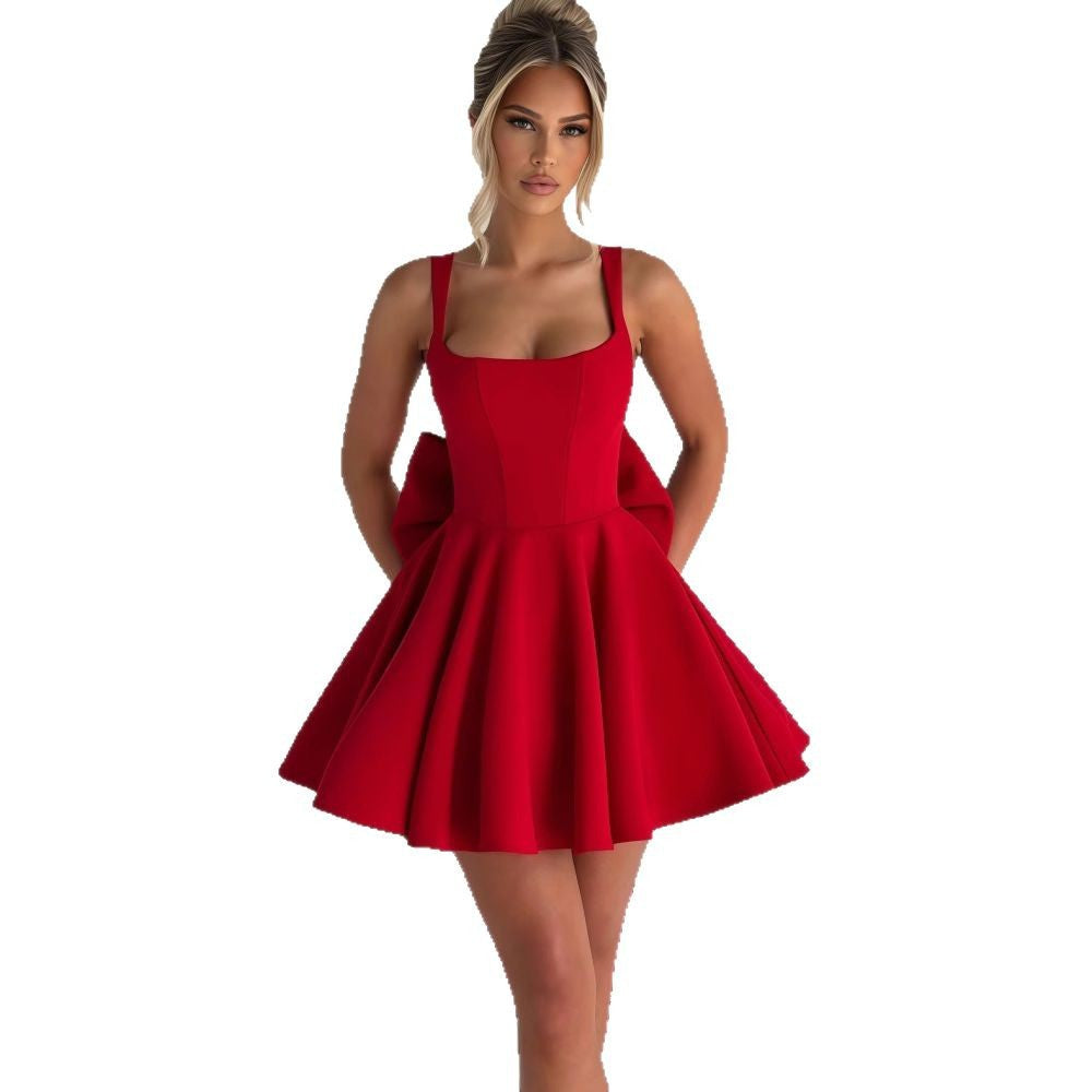 Feminine women's elegant dress with a stunning oversized bow and a beautiful flowing skirt for events.