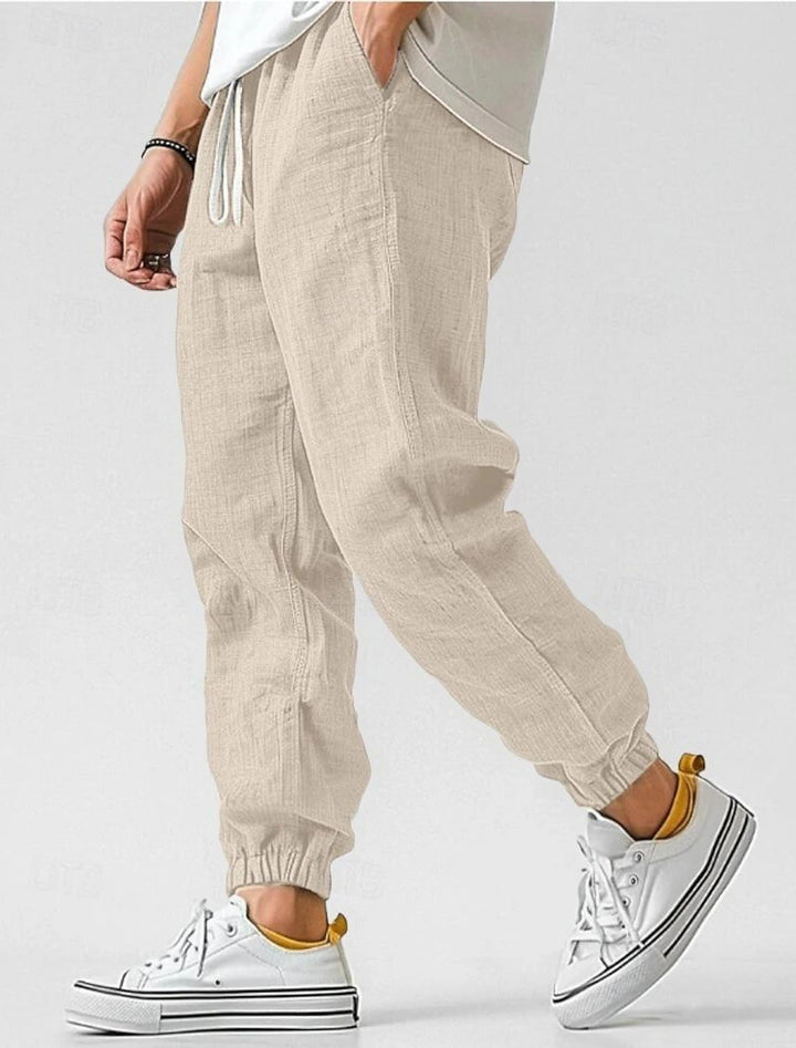 Stylish men's drawstring pants, versatile for everyday fashion, travel, or lounging.