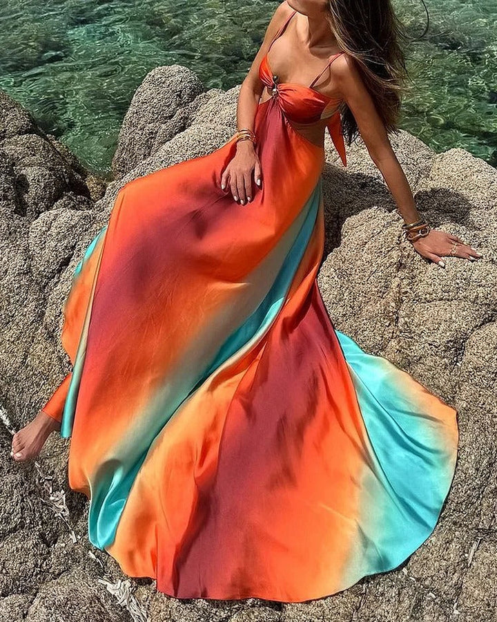 Sleeveless flowing sunset maxi dress for women, a vibrant multicolor summer dress perfect for vacation wear.