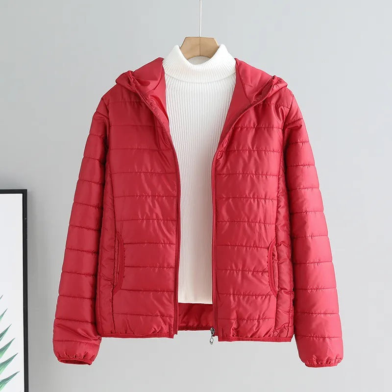 Casual women's hooded quilted jacket in green, essential for fall fashion & light weather.
