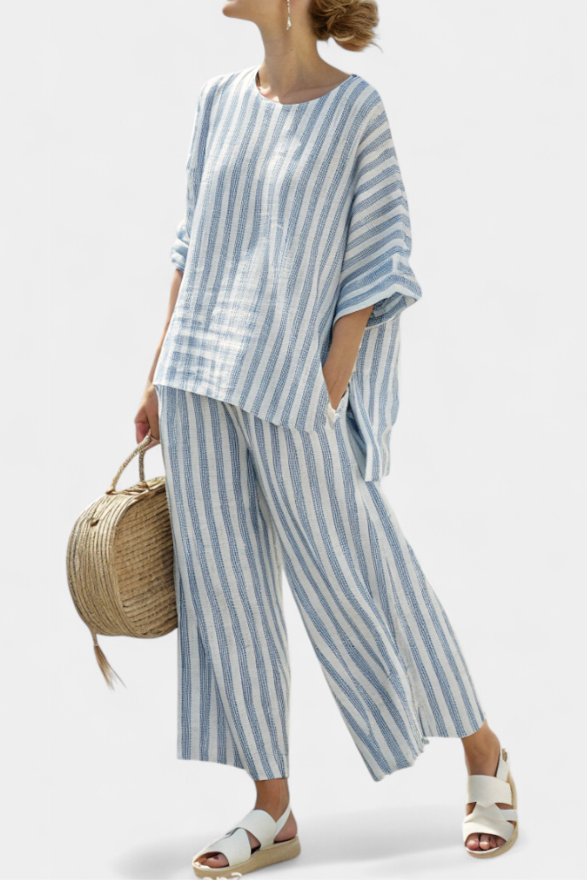 Women's blue striped two-piece set with a relaxed top and wide-leg trousers, perfect for summer casual chic.
