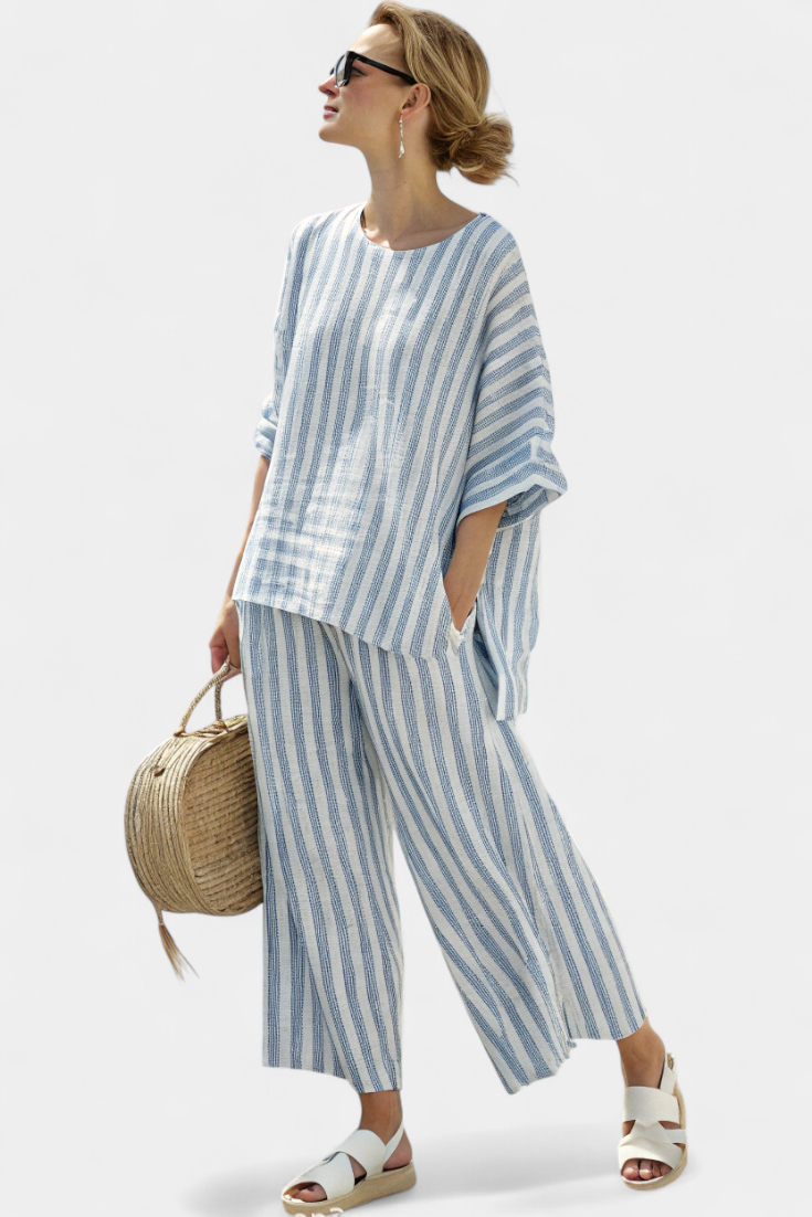 Sophisticated women's blue striped top & relaxed trousers set. A comfortable two-piece for summer style.