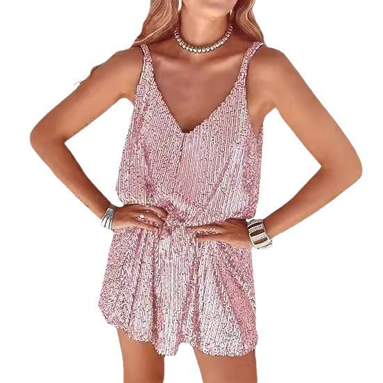 Festive women's jumpsuit, sparkling fabric, deep V-neck, and elastic waist for a chic look.