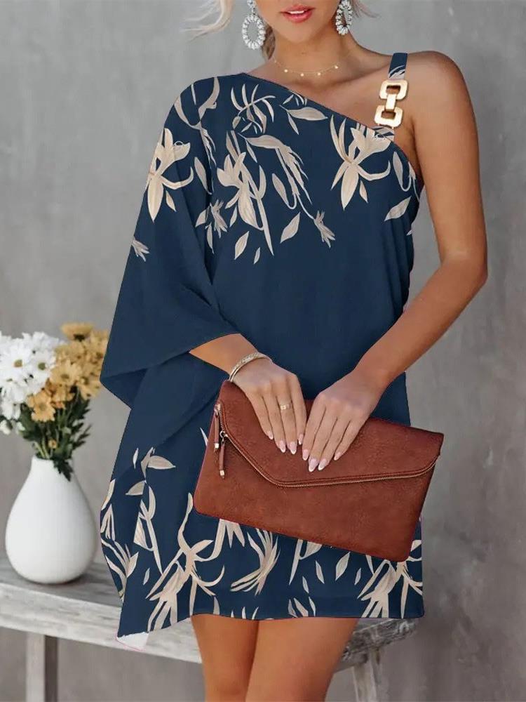 Full-length women's asymmetrical floral dress with elegant straps & flowing skirt, a chic summer outfit.