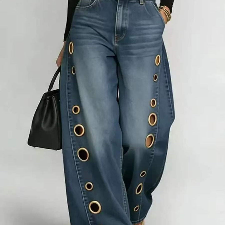 Women's high-waist wide-leg jeans with decorative eyelets, perfect for a chic denim look.