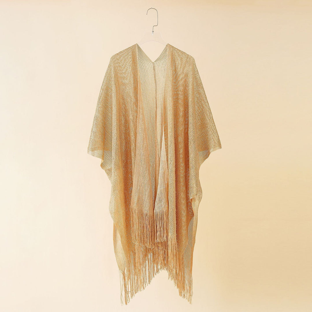 Chic women's fringe kimono, versatile for layering, adds bohemian flair to outfits.
