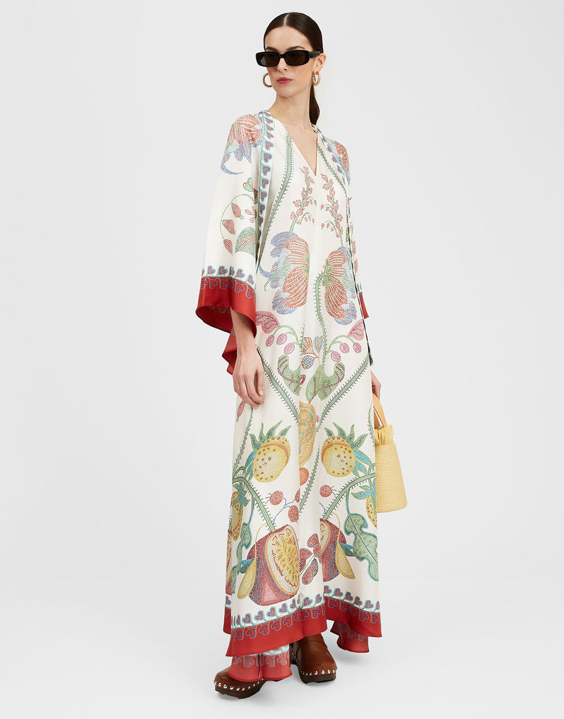 Elegant women's work dress with a vibrant print, three-quarter sleeves, and a sophisticated stand collar.