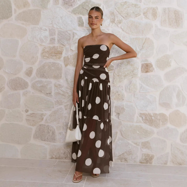 Flowy women's off-shoulder polka dot maxi dress, comfortable and chic for summer outings & casual elegance.