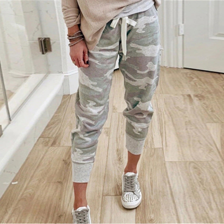 Trendy women's utility cargo pants, relaxed fit, elastic waist, practical side pockets for casual wear.