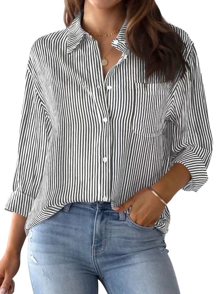 Easy-wear women's loose striped shirt, designed for comfort with a convenient chest pocket.