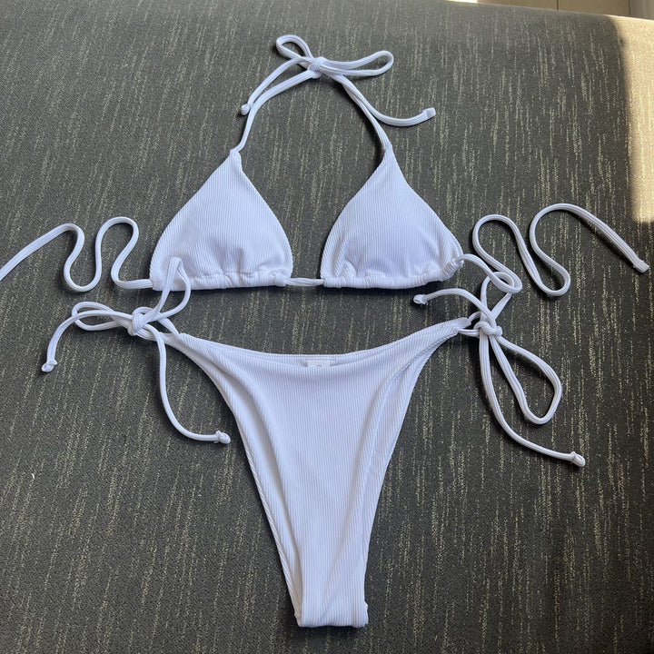 Versatile striped tie-front bikini set. Ideal women's swimwear for various summer water activities.