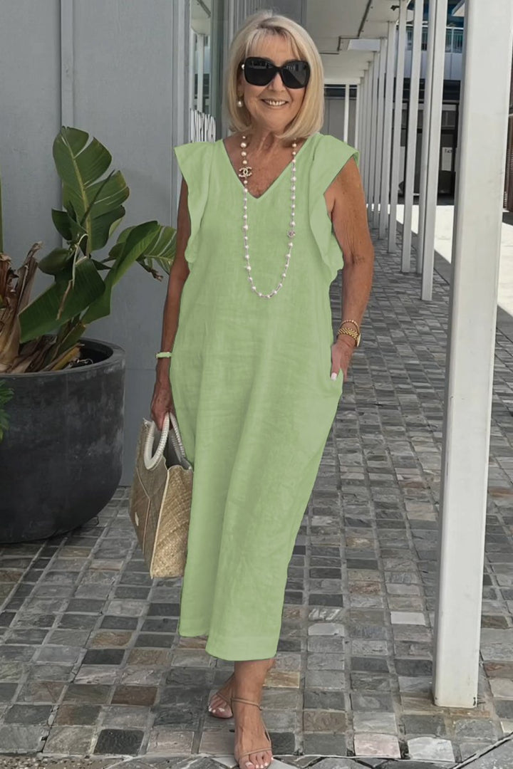 Women's summer maxi dress, sleeveless with a V-neck, offering elegant flow and comfort for casual or vacation.