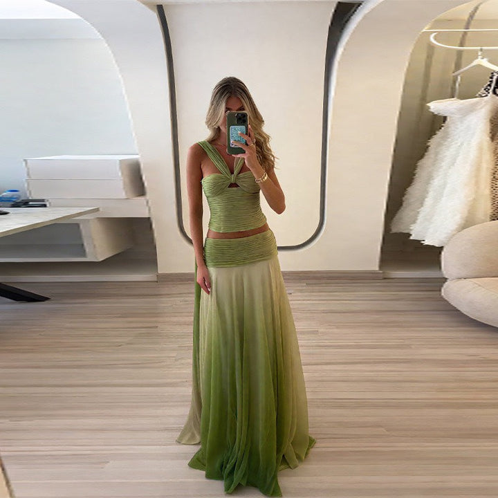 Stunning women's strappy maxi dress with a flowing gradient skirt, suitable for galas and elegant events.